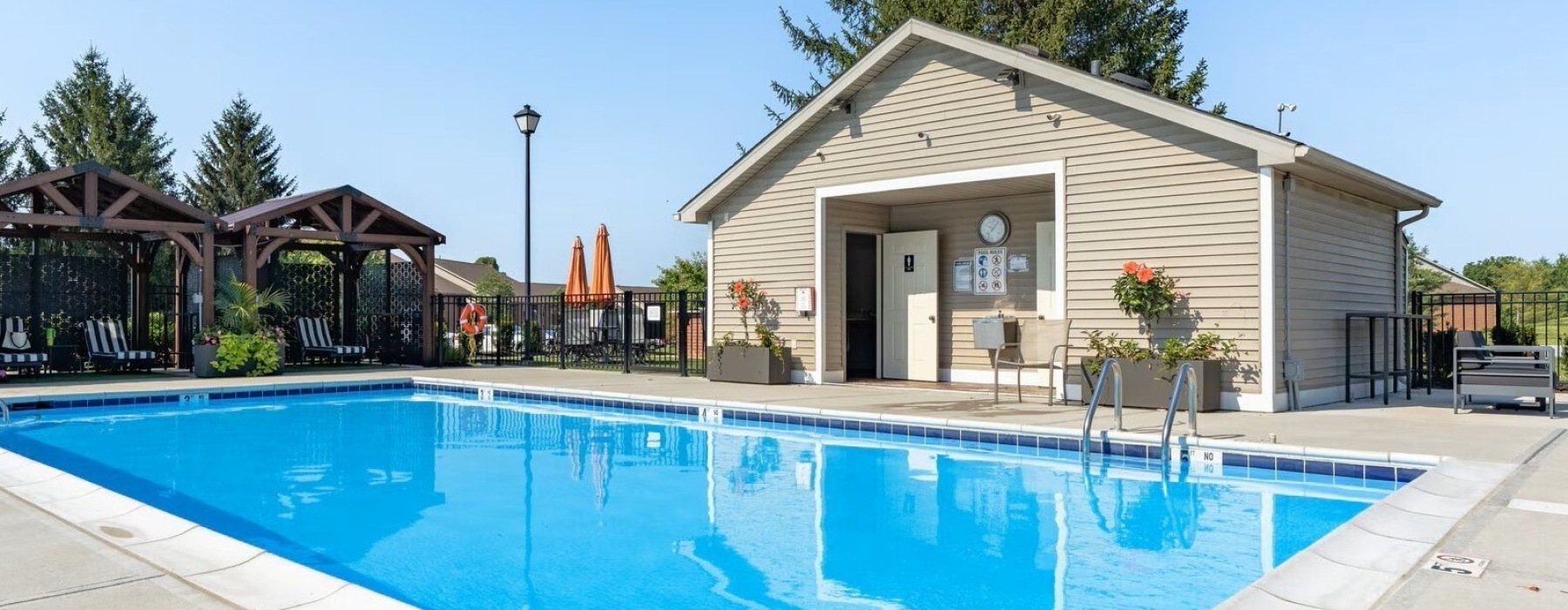 Resort-style swimming pool with lounge seating