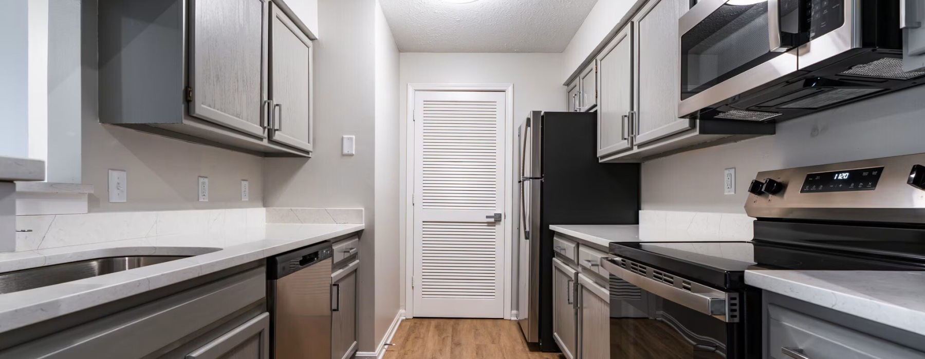 kitchen with wood floors and pantry door
